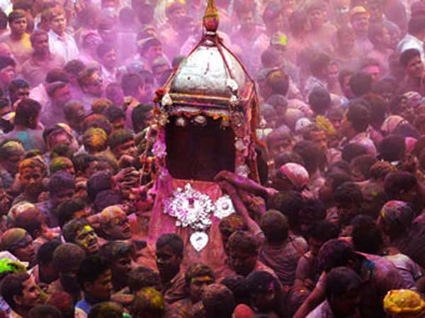 Followers carrying the palanguins of Lord Krishna and Ghunusa - Holi celebrated in  Barpeta.