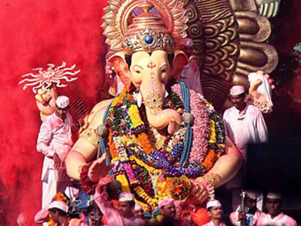 Lord Ganesh on float in festival parade.