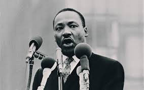 Dr. Martin Luther King speaking to large audience