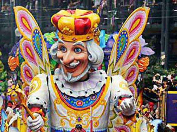Large float with King of the Carnival riding atop in New Orleans, Louisiana Mardi gras celebrations. 