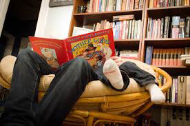 Father reading to son in Library