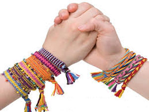 Young hands grasping one another - Friendship Day Young hands grasping one another