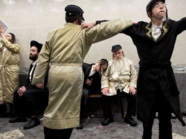 Purim Jewish men dancing and celebrating Purim on the streets.