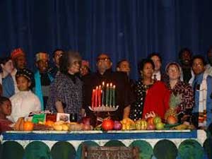 Enjoying a meal for Kwanzaa - Kwanzaa Enjoying a meal for Kwanzaa