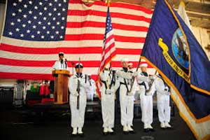 Armed services holding the US flag