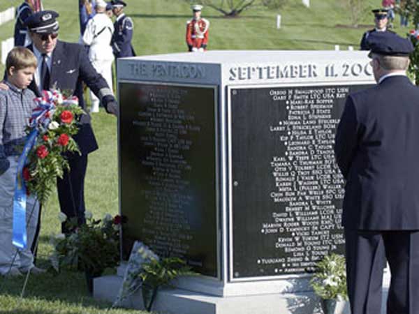 American Airlines pilot shows his son the name of the pilot who died flying the ill fated flight 77 plane in the terrorist attack on the Pentagon.